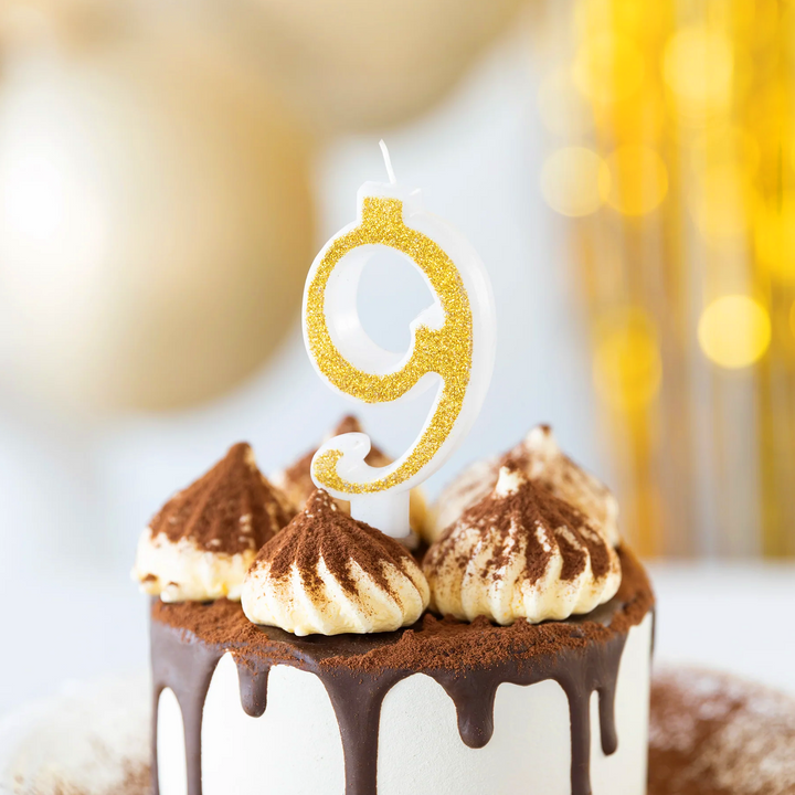 Small gold candle with glitter, number 9