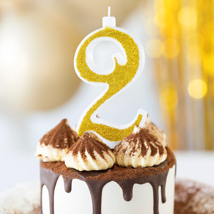 Large gold candle with glitter, number 2