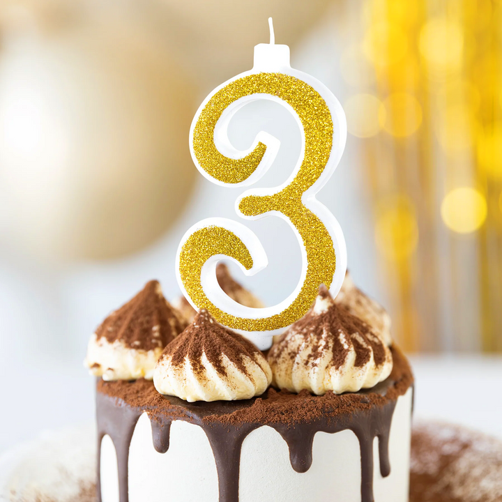 Large gold candle with glitter, number 3