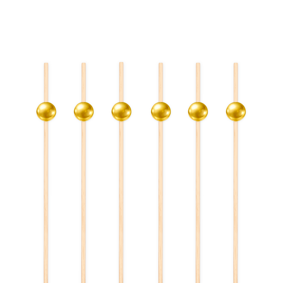 patyczki do przekąsek ozdobione złotą kuleczką 
