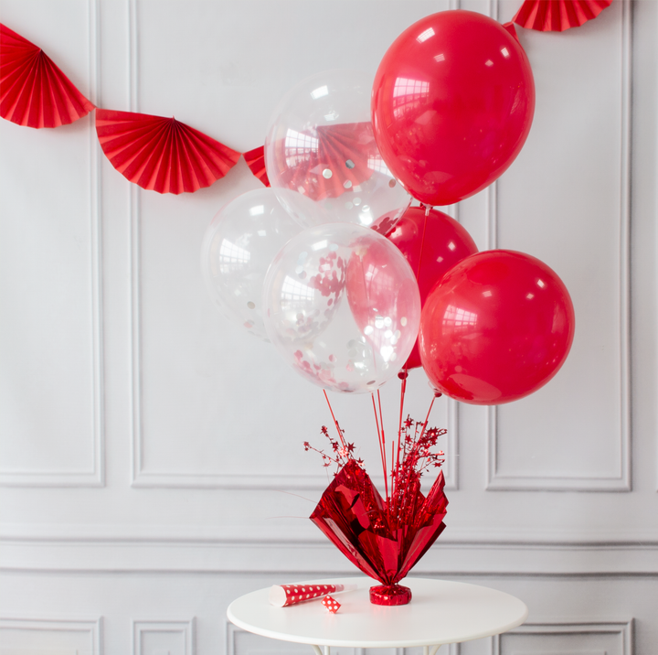 Ciężarek do balonów czerwony z patykami na balony