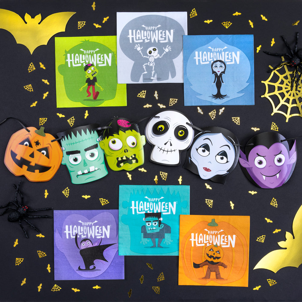 Na czarnym tle ze złotym konfetti, serwetki i baner Halloween Monsters